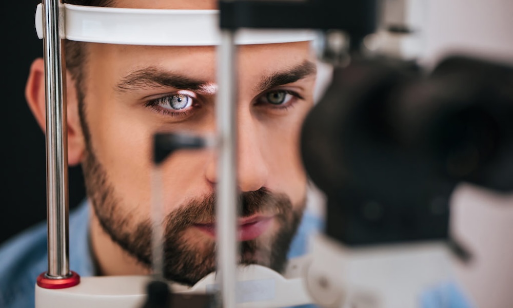 A young man receiving an eye exam